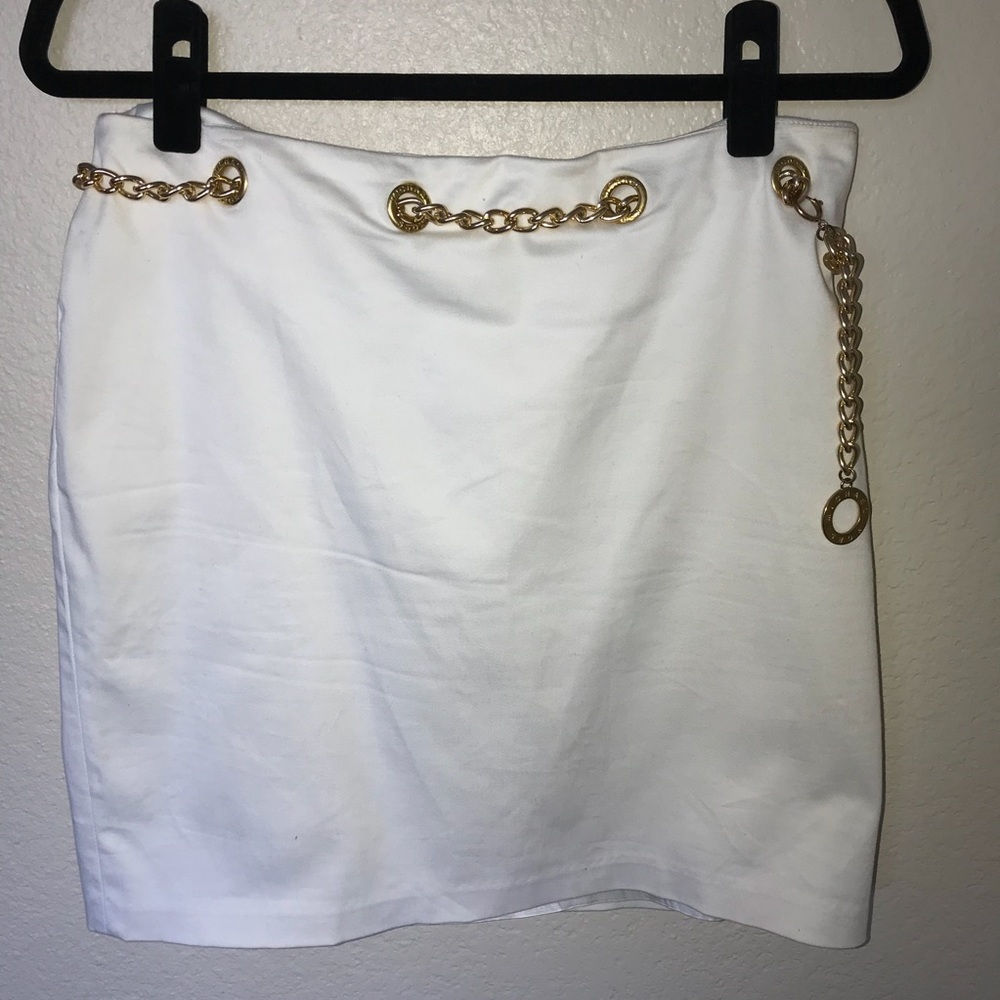 MK white skirt with gold chain.